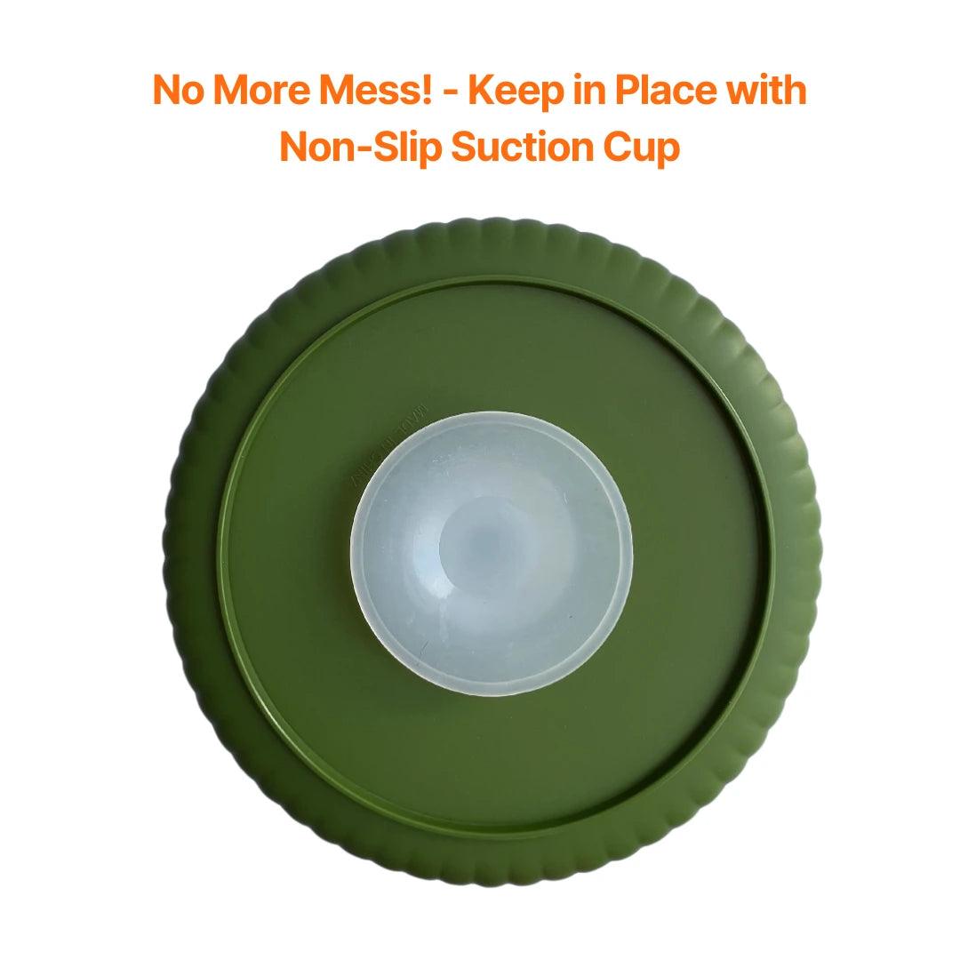 Image description: Slow Feeder with rotating spinner showing suction feature.
Text on image: No more mess! Keep in place with non-slip suction cup.