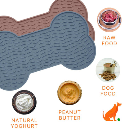 Image description: Lick mat 2 pack, bone shapes, surrounded by pictures of spread options.
Text on image: Natural Yoghurt, Peanut Butter, Dog Food, Raw Food.
