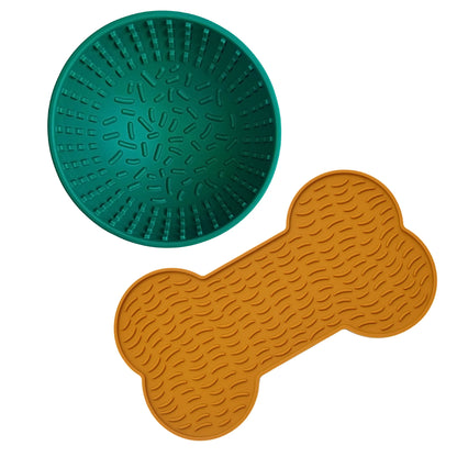 Image description: Wobble lick bowl in colour green and lick mat bone shape in colour mustard.